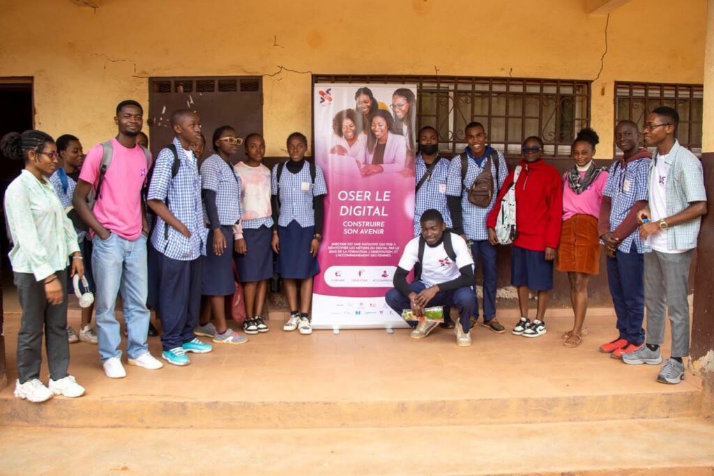 Students gathered around the Dare to go digital banner
